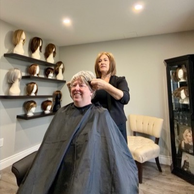 Rebecca White fitting a client during a wig consultation